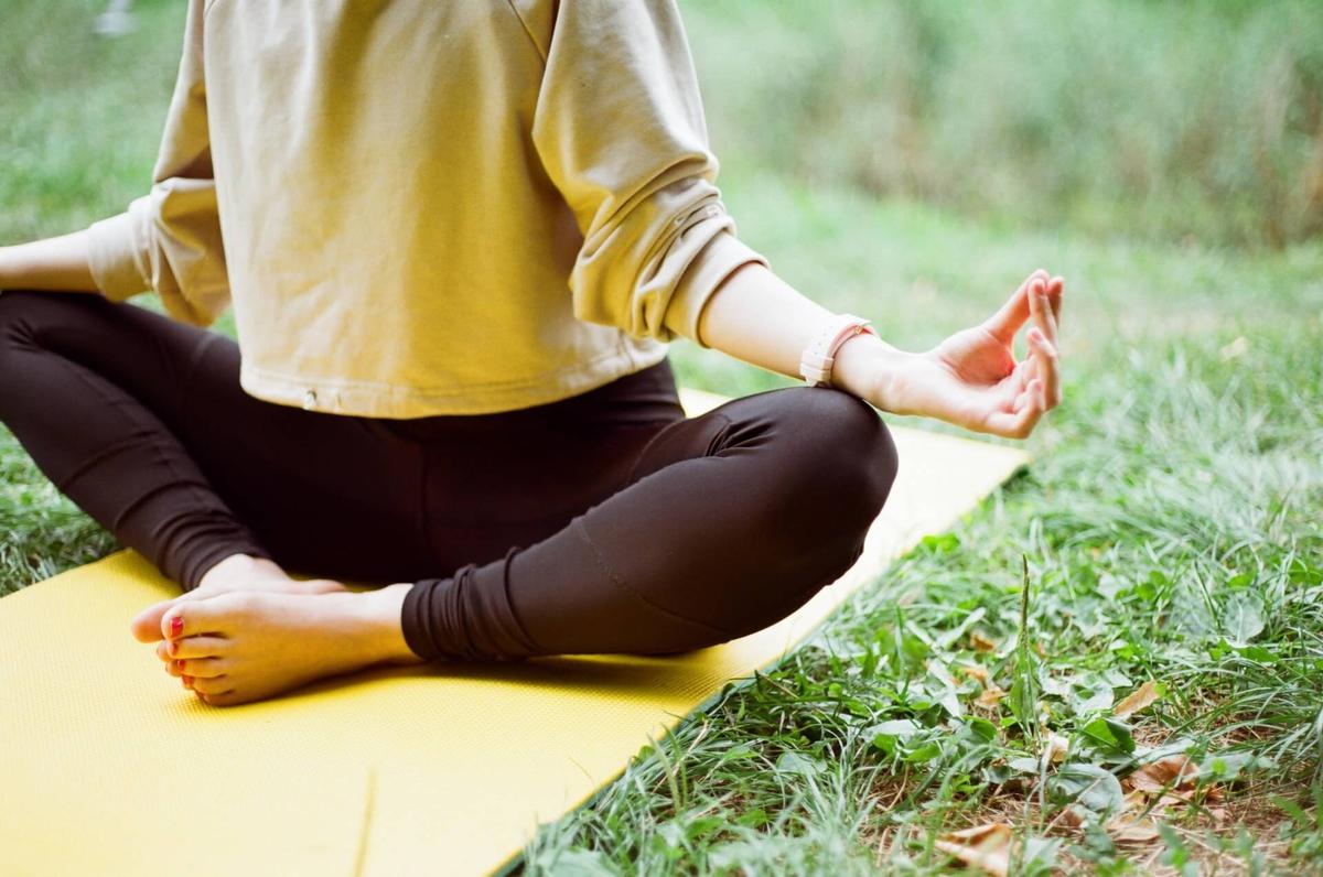 Woman practising yoga outside